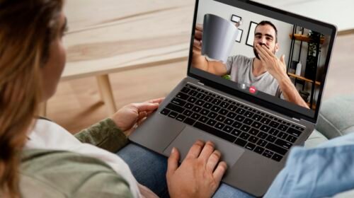 Couple connecting through online chat and video call
